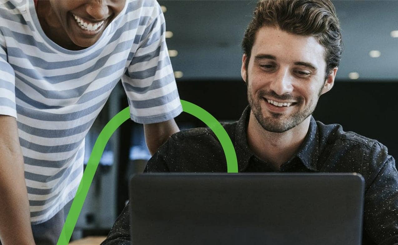 Two people looking at laptop